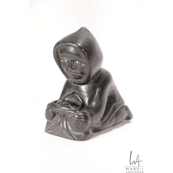 Inuit carved soapstone fisherman, signed in syllabics and dated 1987 by artist, 6" in height
