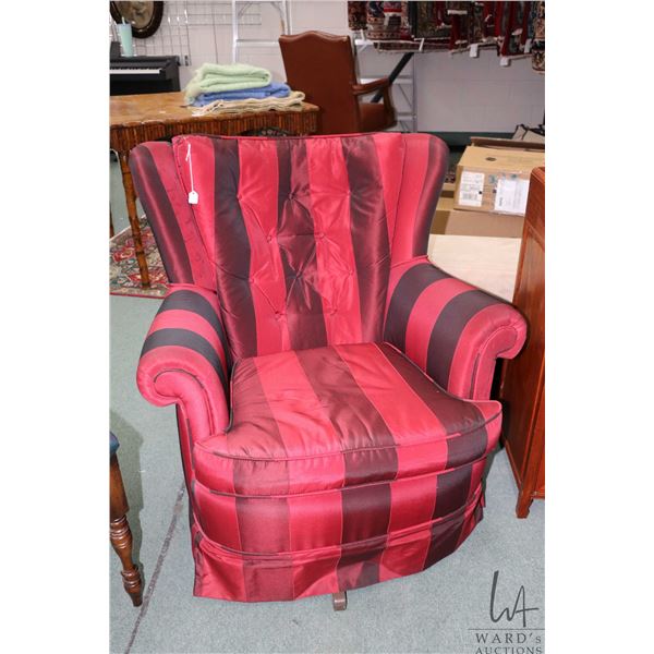 Two vintage upholstered swivel rocking chairs