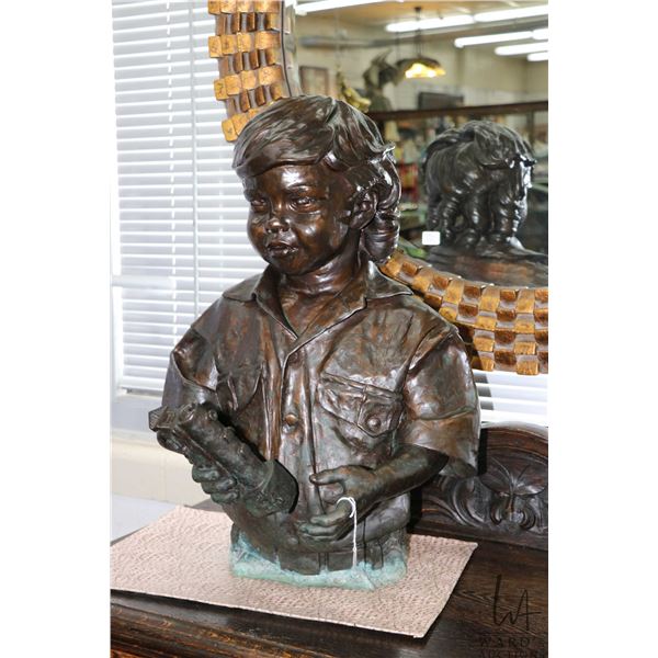 Bronze sculpture of a young boy with his toy train, possibly titled "Coleton Nickolas Landvand,Born 