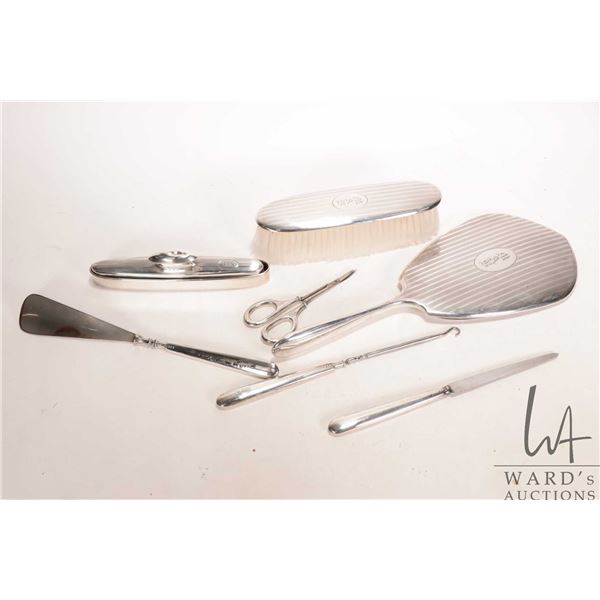 Sterling silver dresser set including brush, hand mirror, nail buffer and tray, shoe horn, button ho