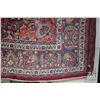 Image 2 : Iranian wool carpet "Mashad" with center medallion on red background and highlights of blues, orange