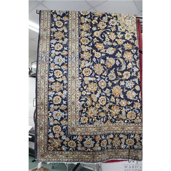 Iranian wool carpet "Mashad with center medallion on blue background with overall floral design and 
