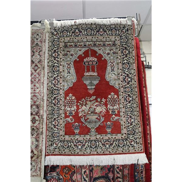 Wool blend scatter rug with brick background and soft toned highlights, 24" X 36"