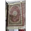 Image 1 : Small scatter rug with center medallion and fringed edging 26" X 41"