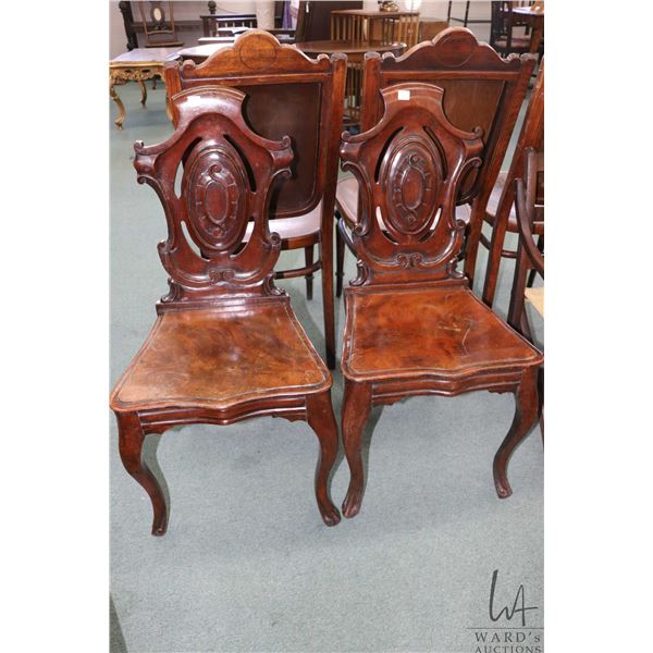 Pair of antique mahogany shield back hall chair with 17" seat height