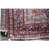 Image 2 : Iranian wool carpet "Mashad" with center medallion on red background and highlights of blues, taupe,