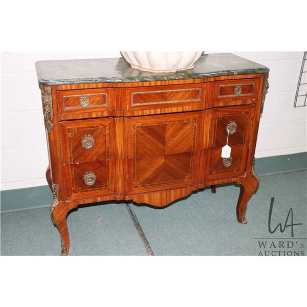 Antique French satin wood three drawer dresser with ormolu decoration and pulls and green marble top