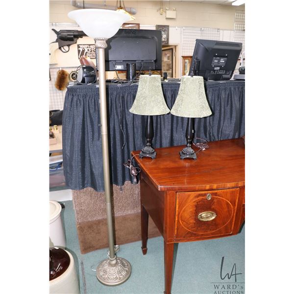 Three modern lamps including one floor standing and two bedside lamps with shades