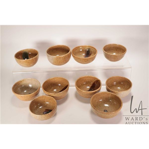Ten artisan made pottery bowls believed to be by L. Kosteriva ( Creech' s Lakeland Pottery Guide) in