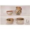 Image 1 : Four artisan made pieces of pottery including 6" high pitcher and three approximately 5" diameter bo