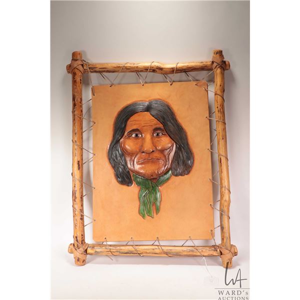 G. Heresco, signed sculpture on leather portrait of an Indigenous man, dated 2002. Overall dimension