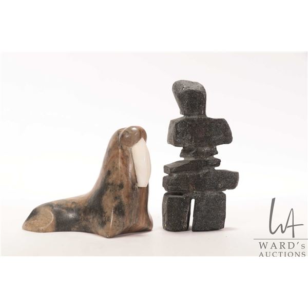 Two Inuit soapstones including 5 1/2" Inukshuk and a walrus signed by artist Thorn 3 3/4" in height
