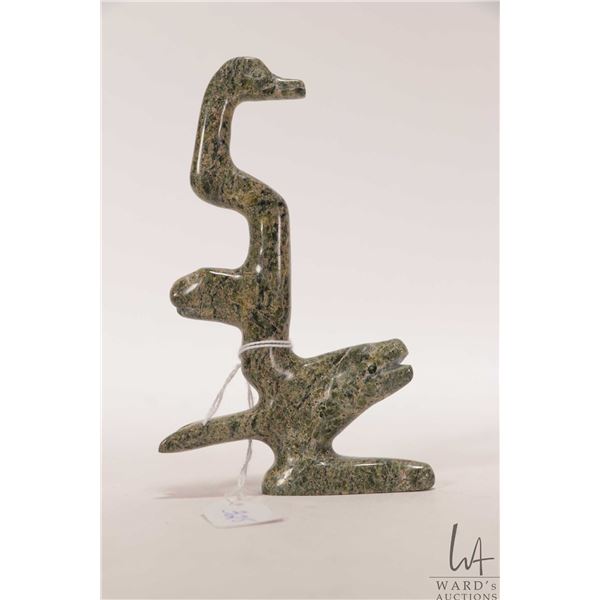 Hand carved green marble sculpture featuring salmon, seal and duck figures, 5 1/2" in height