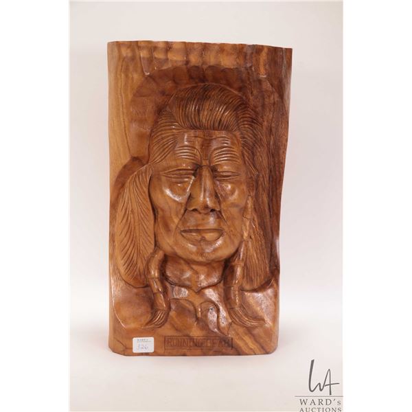 Solid wood carving titled "Running Bear" no artist signature seen, 14 1/2" in height X 8 1/2" W