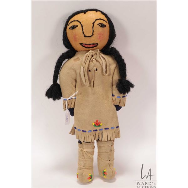 Hand made Indigenous buck skin doll with beaded dress and mukluks, 12" in height