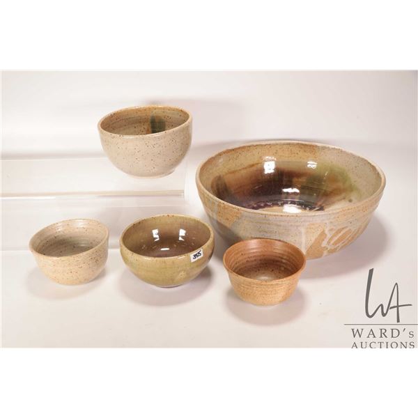 Five artisan made pottery bowls including 4 1/2" to 12" in diameters
