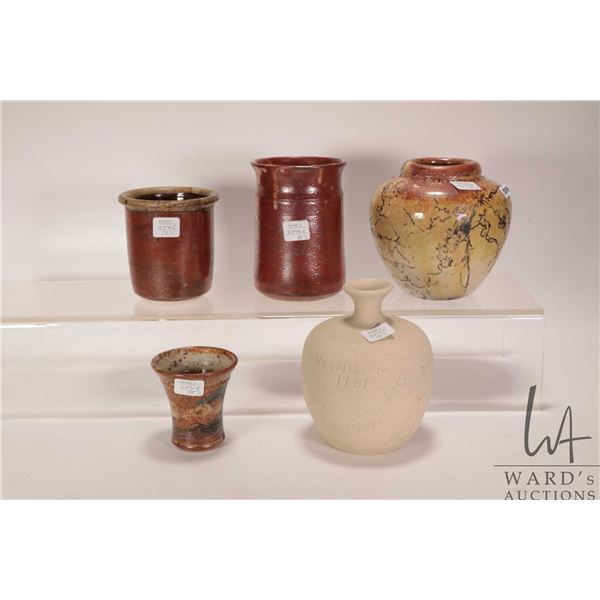 Five pieces of artisan pottery including three signed pieces ranging from 3" to 5 1/2" in height