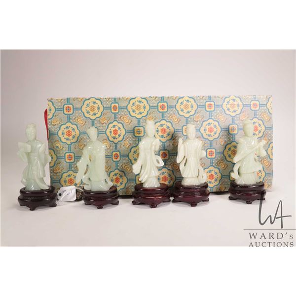 Five jade like carved Chinese figures in fitted box
