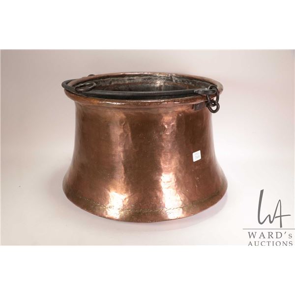 Large hand hammered copper kettle with wrought iron handles, 14 1/2" in diameter and 10 1/2" in heig