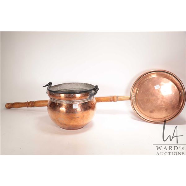 Vintage copper bed warmer with 30" wooden handle and a vintage copper pot, 9-1/2" wide, 8" tall