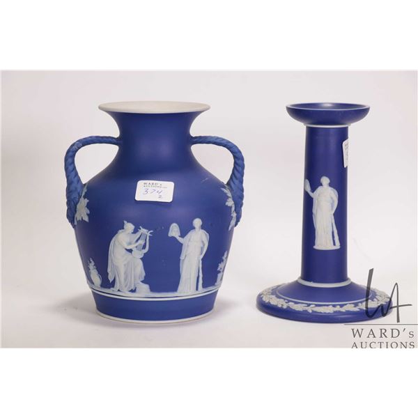 Two Pieces of Cobalt Blue Wedgwood Jasperware including 6" candle stick and a 6" Portland Vase