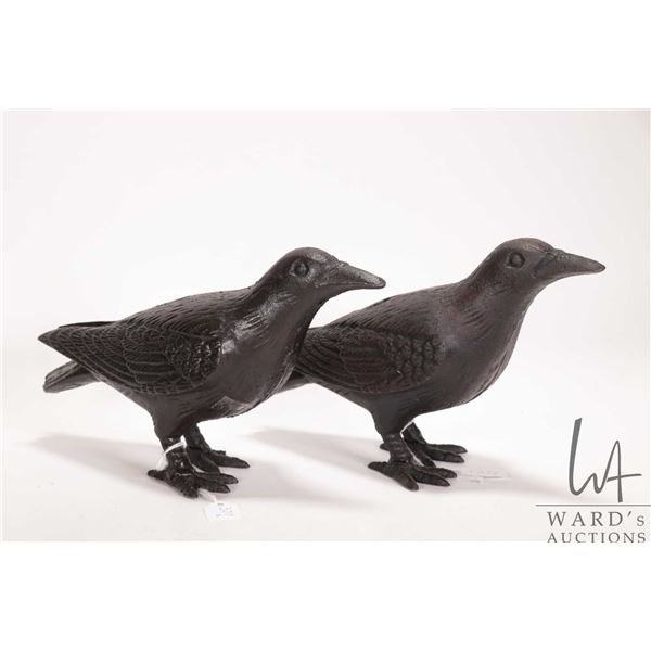 Two Cast Black Bird Door Stops. Measure 10" across and 6" tall. Note, one has a broken toe