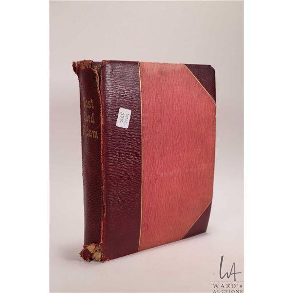 Antique post card album with apprx 150 black and white post cards featuring scenes in France circa 1