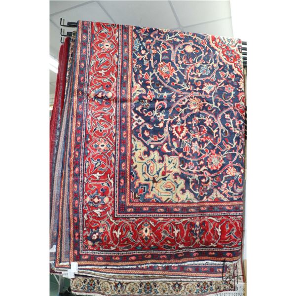 Iranian wool carpet "Mahal' with center medallion, blue background and highlights of red, cream and 