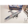 Image 2 : Two Wings of Texaco die cast airplane models including "1927 Ford Tri-Motored Monoplane" and "1929 W