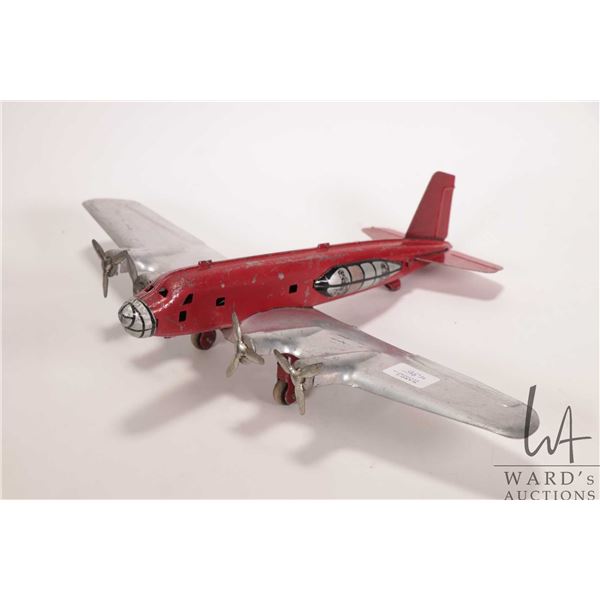 Marx vintage tin plate toy airplane, 10" in length, note: missing rear wheel