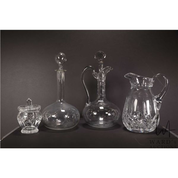 Two vintage drinks decanters plus a heavy pitcher and a lidded spooner