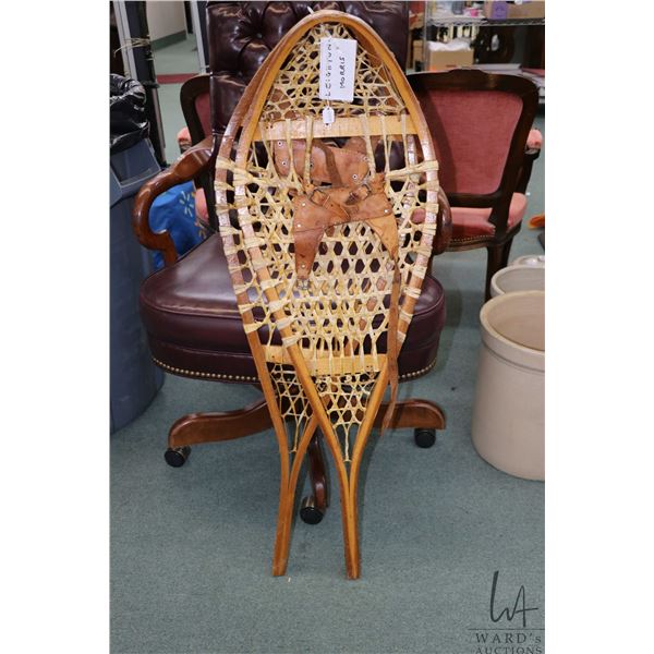 Pair of 41" long Beaver tail style snowshoes with leather bindings, appear unused