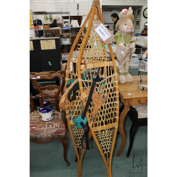 Pair of 58" long Huron snow shoes with leather bindings, appear unused