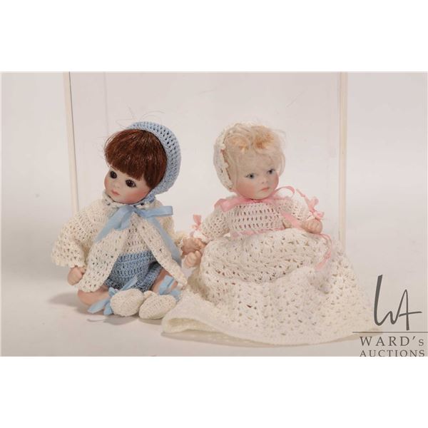 Two small artist made all-bisque baby dolls including 5" boy with glass eyes in knit costume and gir