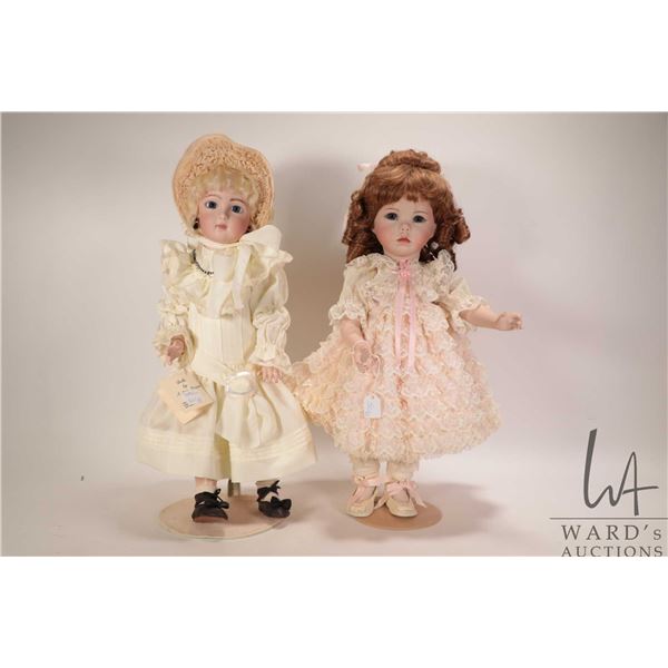 Two reproduction bisque dolls including Long face Jumeau with threaded glass eyes and mohair wig on 
