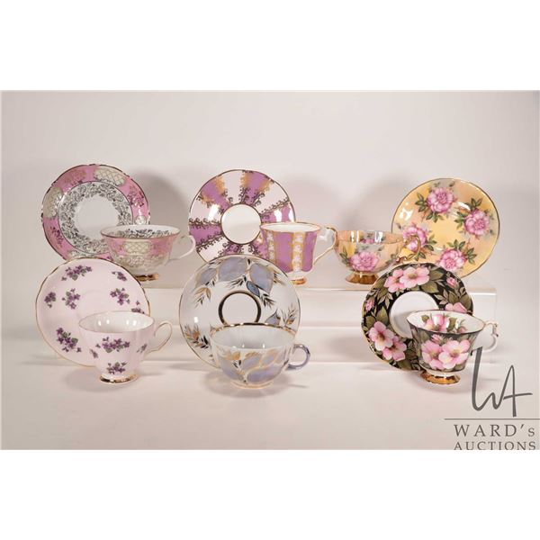 Six collectible china tea cups and saucers including Aynsley, Elizabethan, Colclough, Royal Albert, 