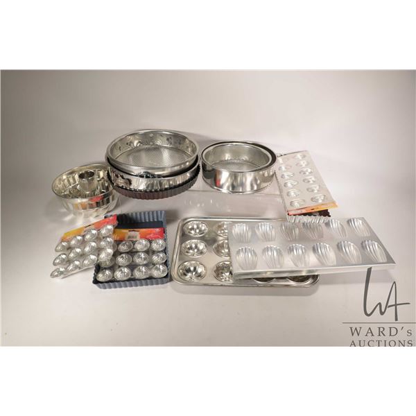 Selection of as new bakeware including spring form pans, loose bottom rectangular non-stick tart cas