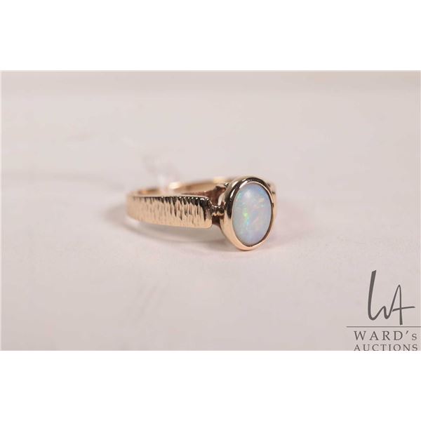 10kt yellow gold ring set with oval opal gemstone, 2.7 grams, size 7