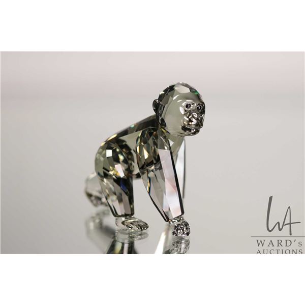 Swarovski smoked crystal "Gorilla Cub" no. 952504, 2 1/2" in height. Includes original box and a mir