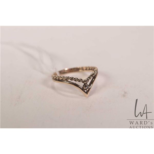 10kt yellow gold ring set with small accent diamond, 1.5 grams, size 5