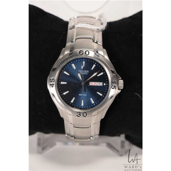 Gent's Citizen quartz wrist watch with day/ date and water resistant up to 100 meter. Not working at