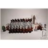 Image 1 : Forty four vintage Avon chess pieces half containing an amount of Avon gent's fragrance, some full. 