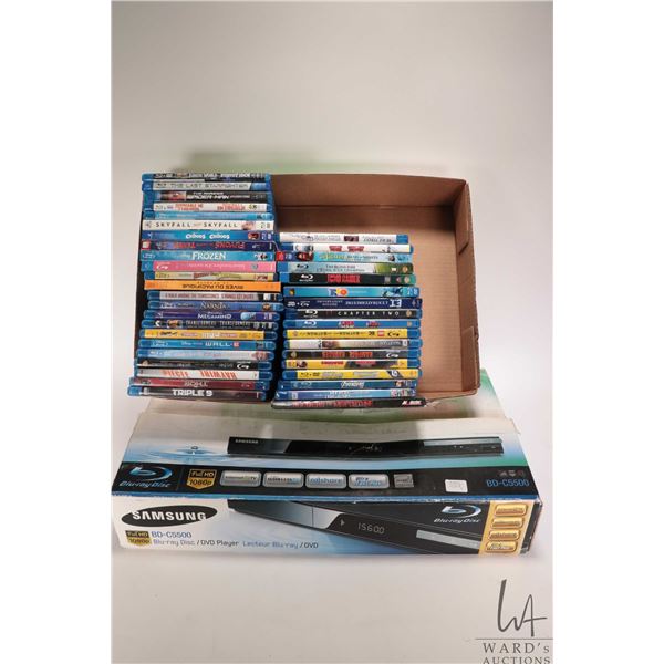 Samsung Blu-ray Disc/DVD player with remote, appears to work, not confirmed. Includes forty blu-ray 