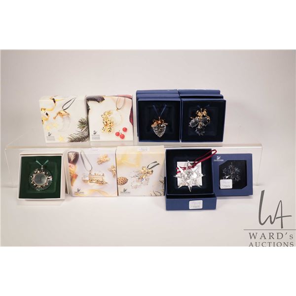 Nine Swarovski crystal hanging Christmas ornaments with original boxes