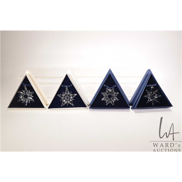 Four Swarovski crystal Christmas ornaments including 1998, 2003, 2007 and 2009