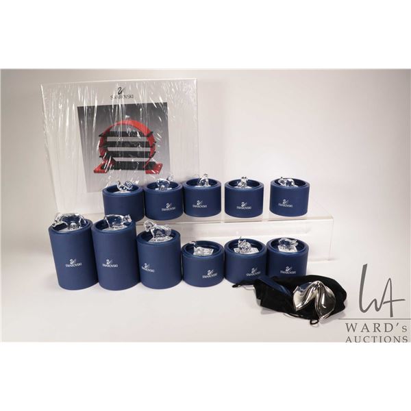 Swarovski crystal Zodiac with eleven zodiac animals and display stand plus a silver-plate Swarovski 