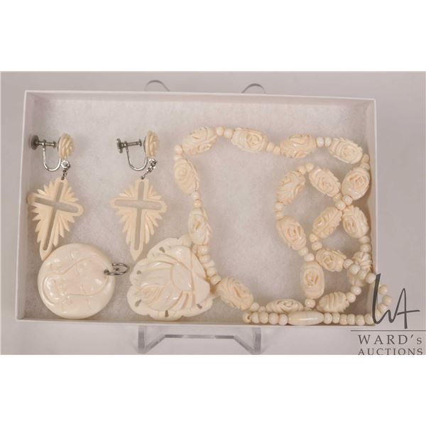 Three pieces of hand carved jewellery including 18" carved beaded necklace with pendant, a pair of e