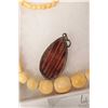 Image 3 : Graduated beaded ivory 17" necklace and a hand carved pendant. Can not be shipped outside of Canada.