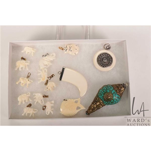 Selection of hand carved miniature elephant pendants, decorative seashell pendant with applied stone