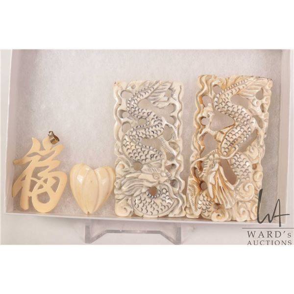 Two carved Asian dragons plus a Chinese character pendant and a carved heart. Can not be shipped out
